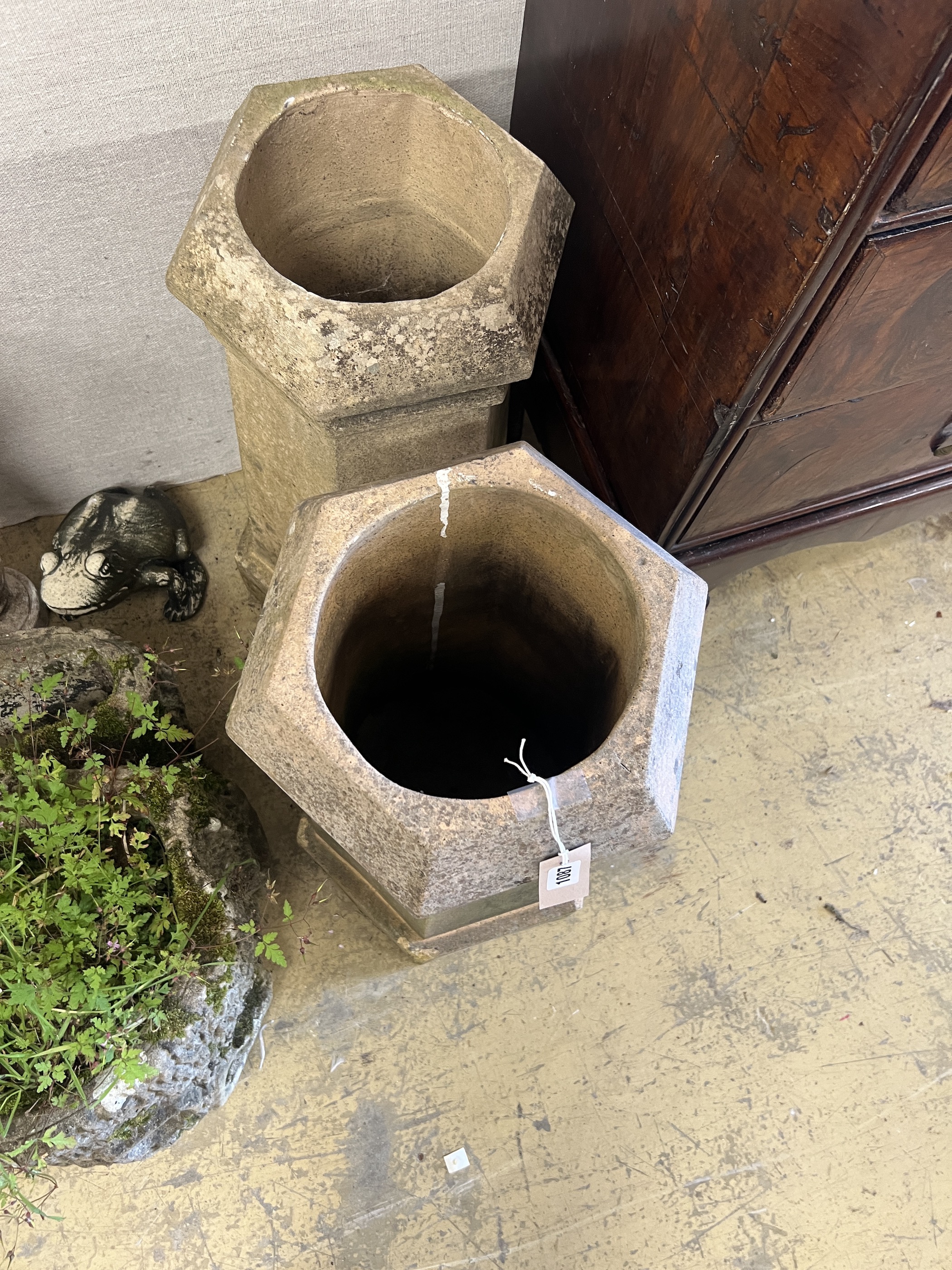 A pair of hexagonal terracotta chimney pots, height 69cm